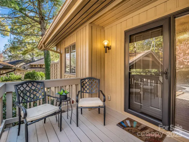 a view of a balcony with furniture