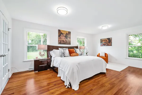 a bed room with bed and a window