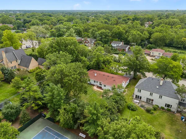 an aerial view of a house with a yard
