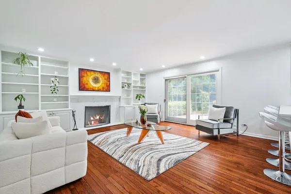 a living room with furniture and a fireplace