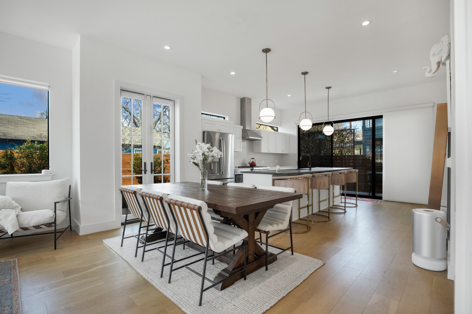 1410 East 3rd Street, Unit A Austin, TX 78702 - Photo 6 of 40 a dining room with furniture and wooden floor