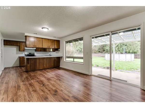 a view of kitchen with wooden floor