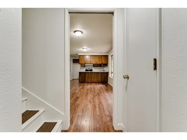 a view of a living room with a wooden floor