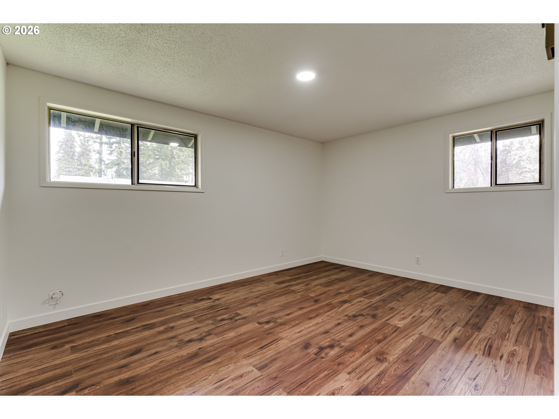 38730 Natures Garden Street Springfield, OR 97478 - Photo 16 of 37 an empty room with wooden floor and windows