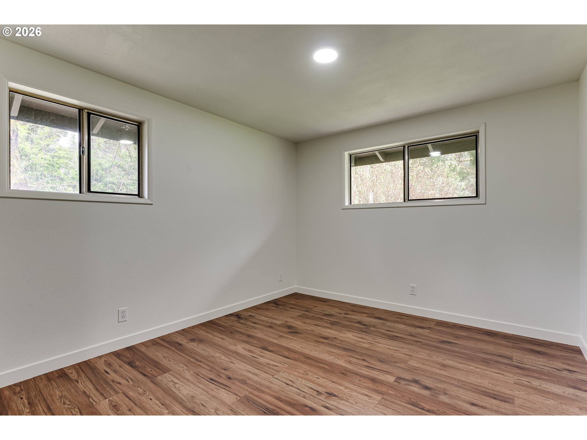 38730 Natures Garden Street Springfield, OR 97478 - Photo 20 of 37 an empty room with wooden floor and windows