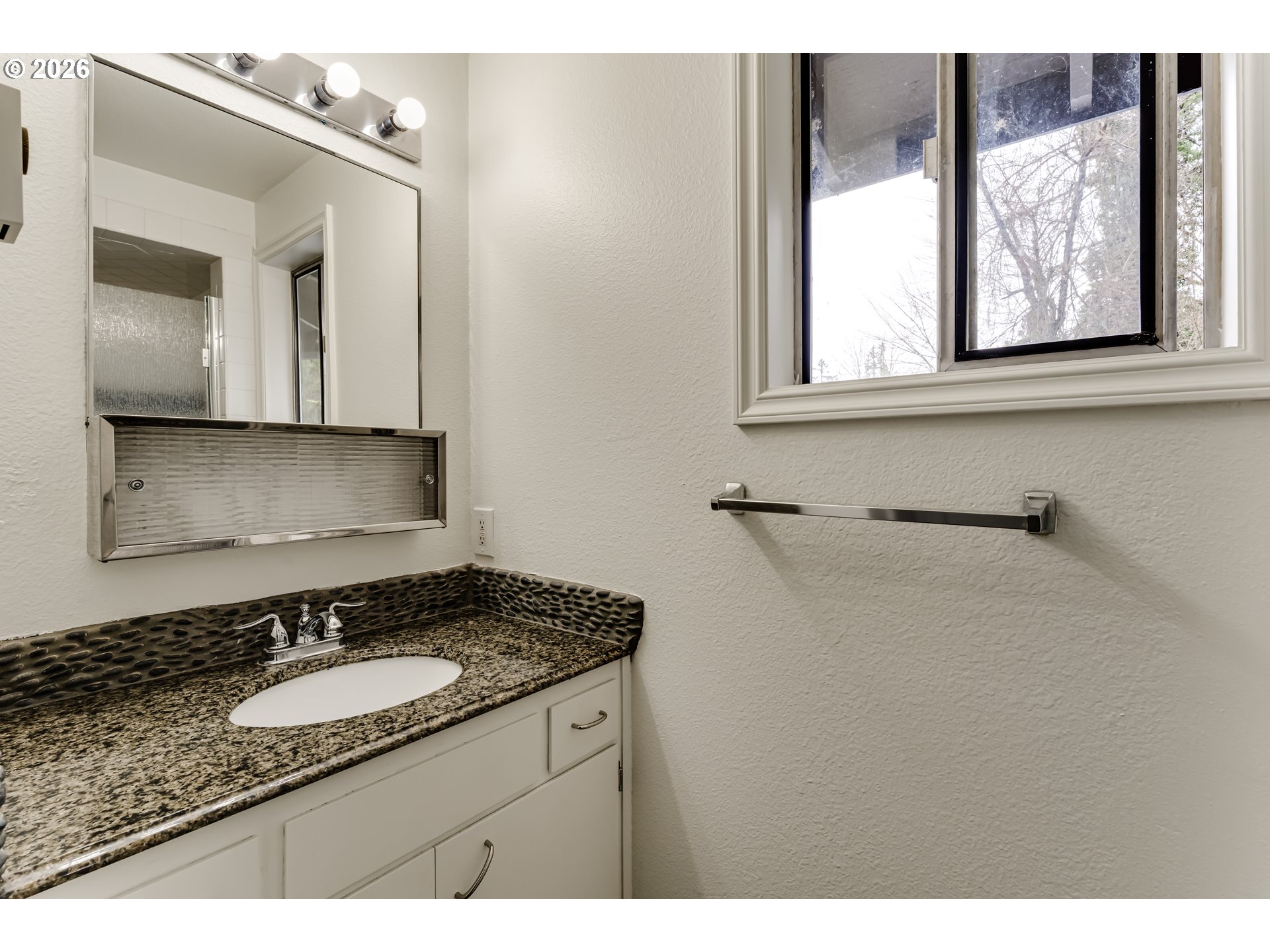 38730 Natures Garden Street Springfield, OR 97478 - Photo 30 of 37 a bathroom with a granite countertop sink and a mirror