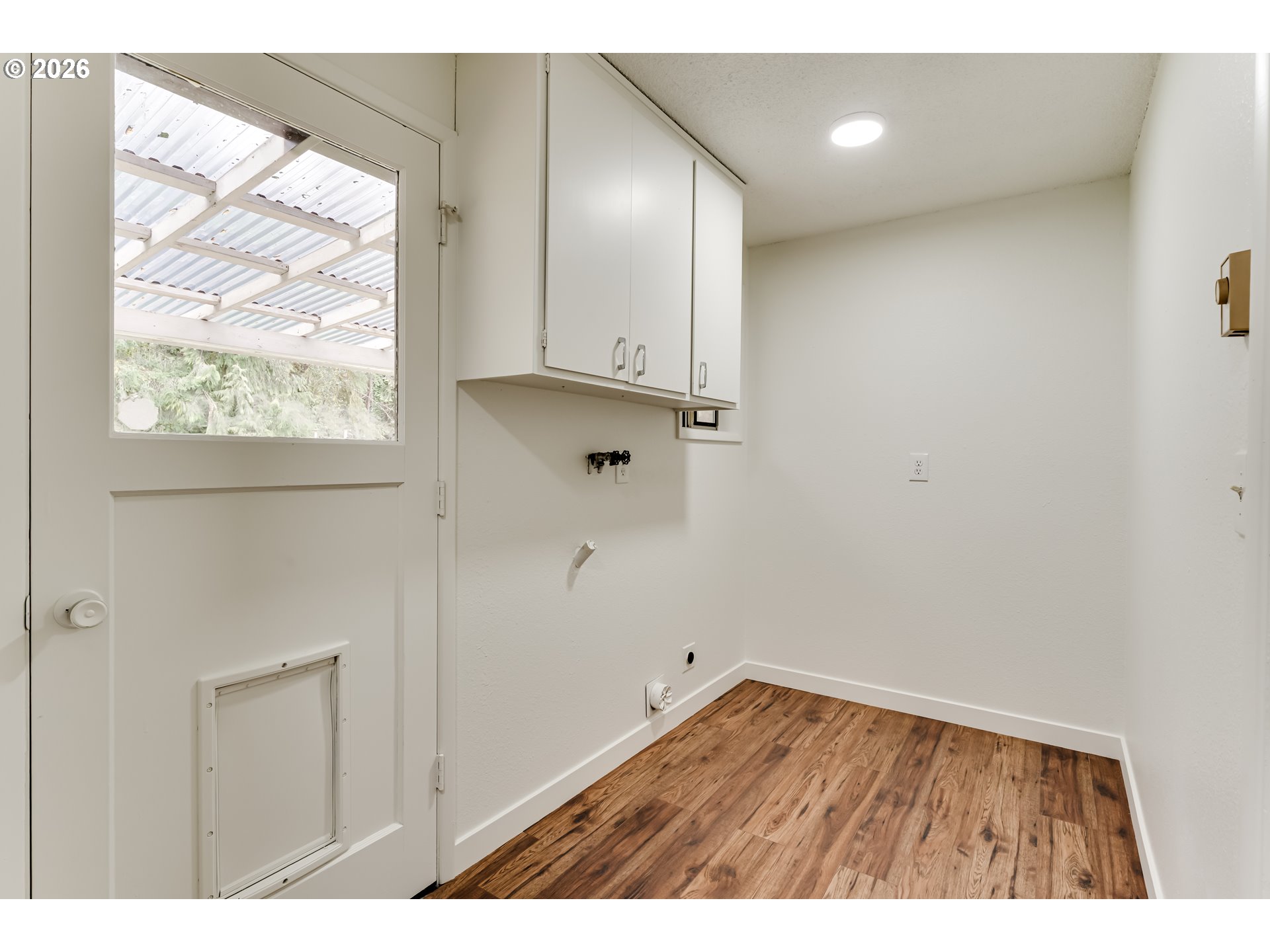 38730 Natures Garden Street Springfield, OR 97478 - Photo 31 of 37 a view of an empty room with wooden floor and a window