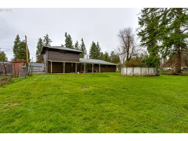 a view of a house with a yard porch and sitting area
