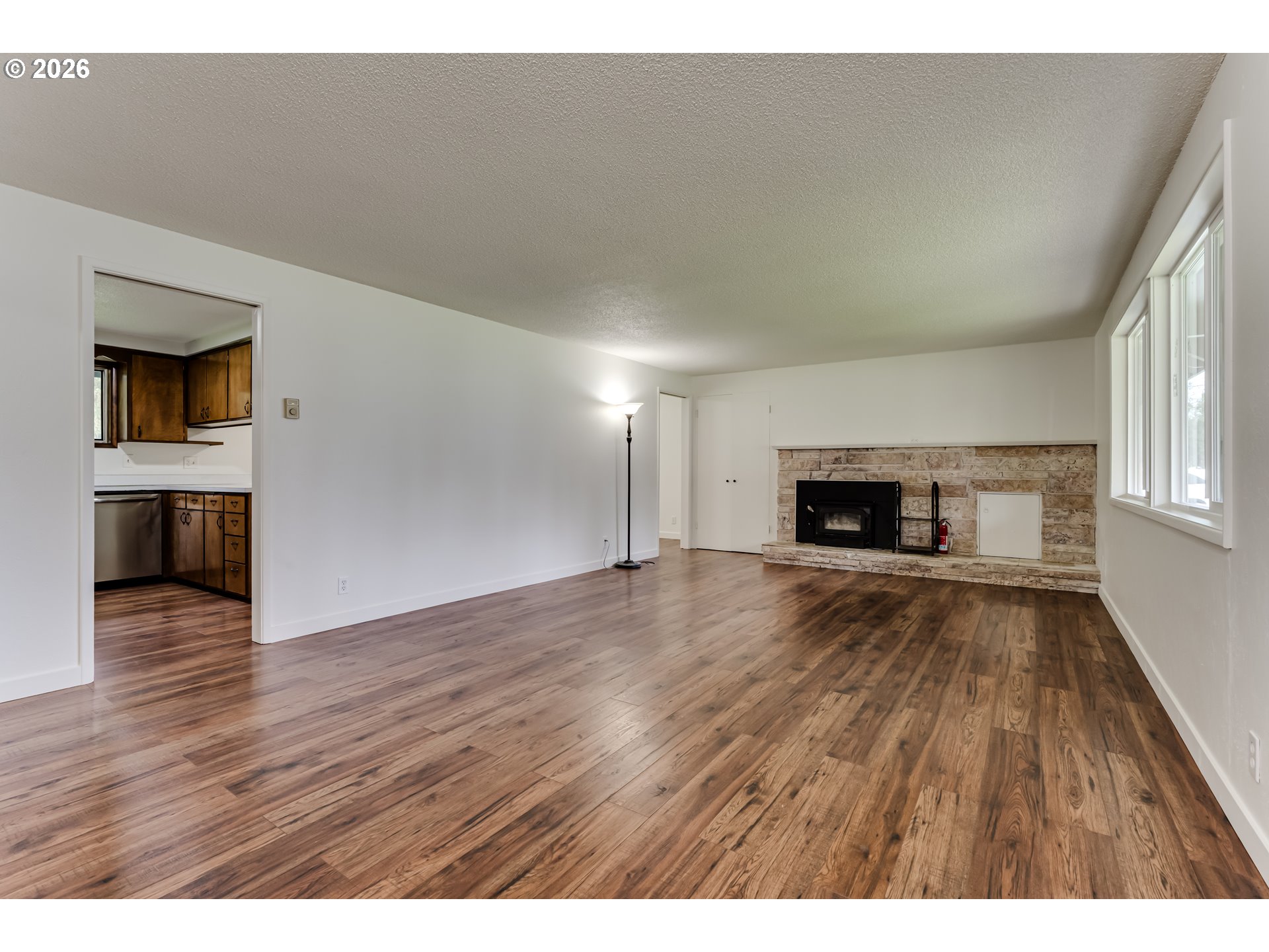 38730 Natures Garden Street Springfield, OR 97478 - Photo 7 of 37 a view of empty room with wooden floor and fireplace
