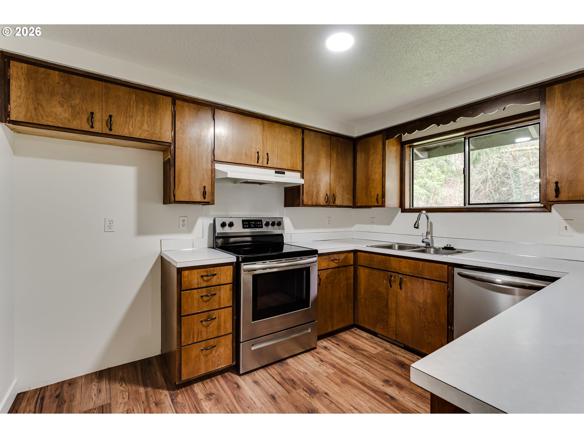 38730 Natures Garden Street Springfield, OR 97478 - Photo 10 of 37 a kitchen with stainless steel appliances granite countertop a stove a sink and a microwave