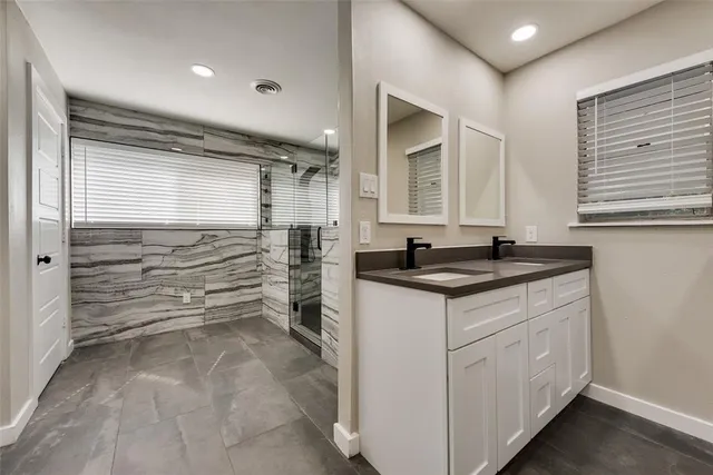 a kitchen with granite countertop a sink and a stove