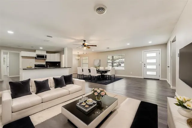 a living room with furniture and a table