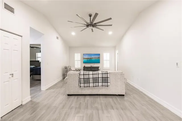 a view of livingroom with hardwood floor and a ceiling fan