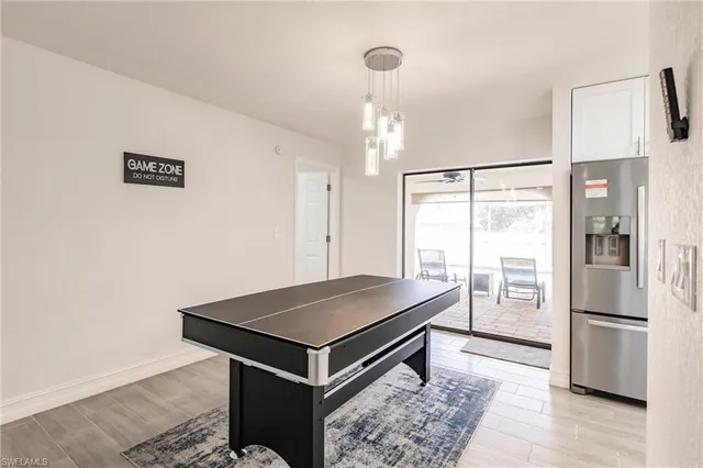 a view of kitchen island with cabinets and wooden floor