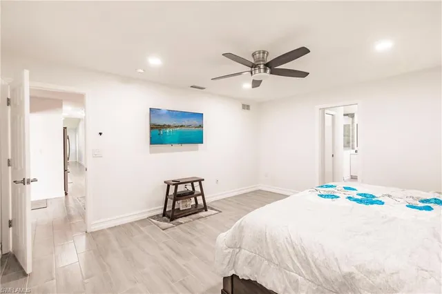 a bedroom with a bed and a table