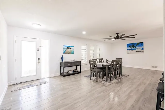 a dining room with furniture and window
