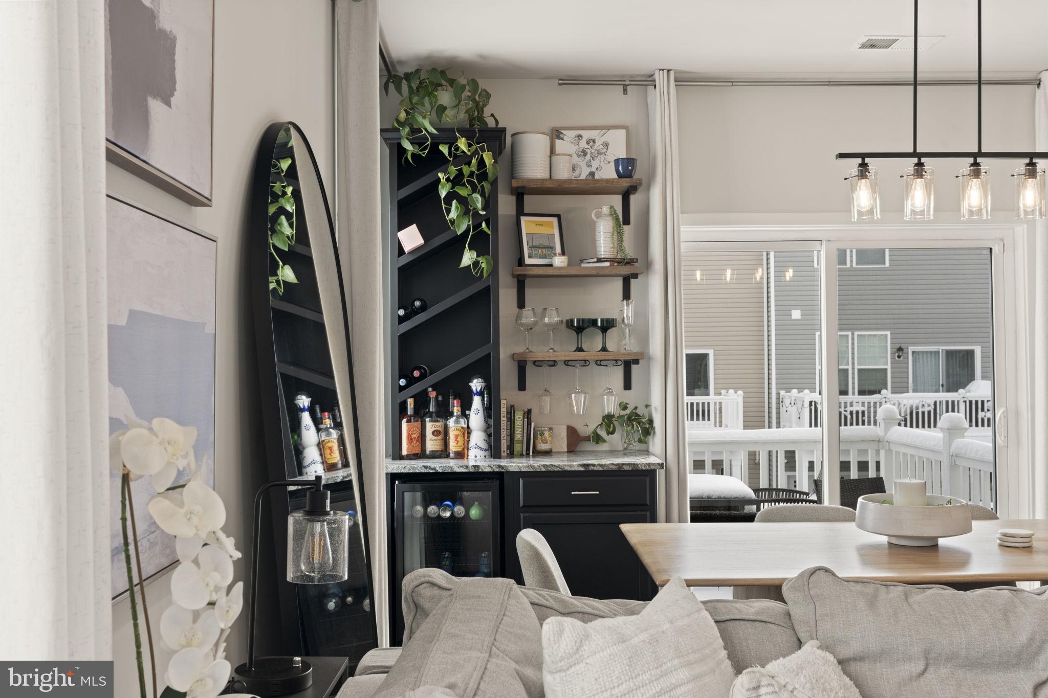 917 Anvil Court Phoenixville, PA 19460 - Photo 12 of 34 a living room with furniture a rug and a book shelf