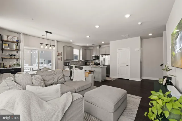 a kitchen with stainless steel appliances a refrigerator stove and sink