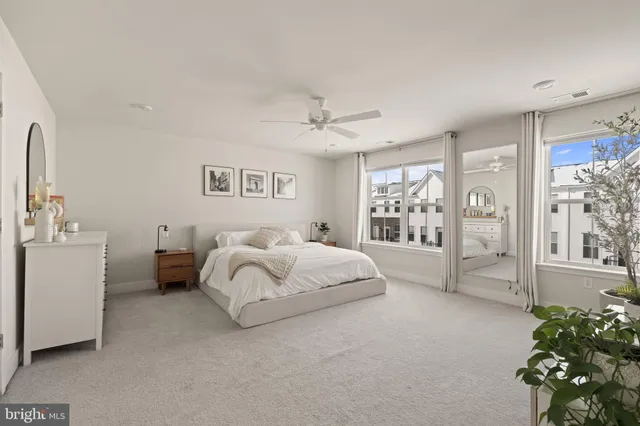 a bathroom with a shower sink and mirror