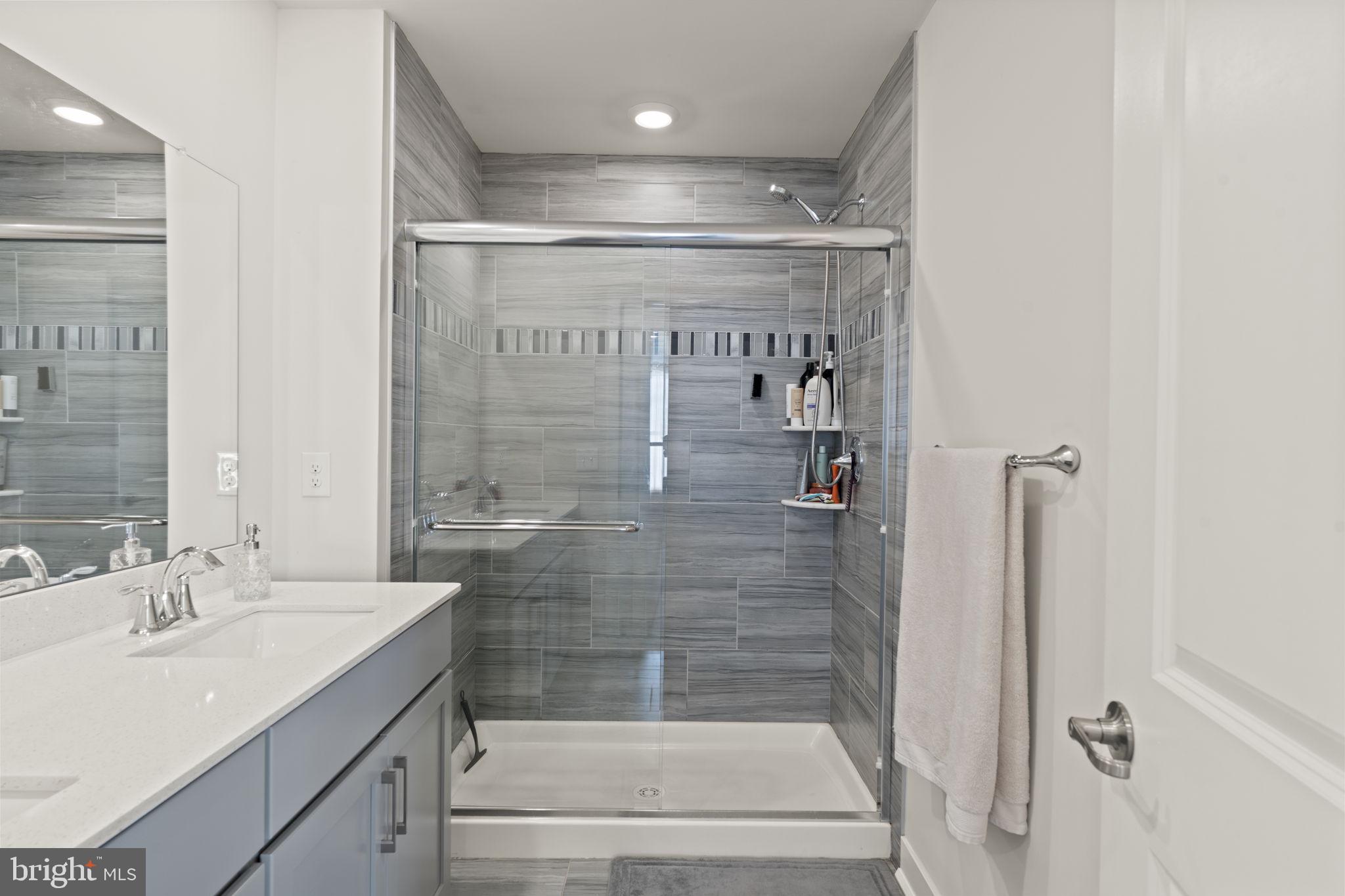 917 Anvil Court Phoenixville, PA 19460 - Photo 25 of 34 a bathroom with a shower and sink
