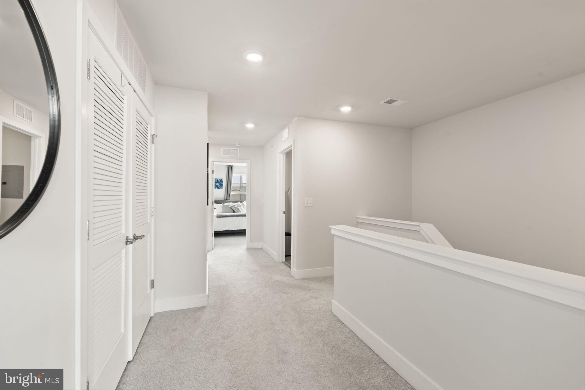 917 Anvil Court Phoenixville, PA 19460 - Photo 26 of 34 a view of a hallway with wooden shelves