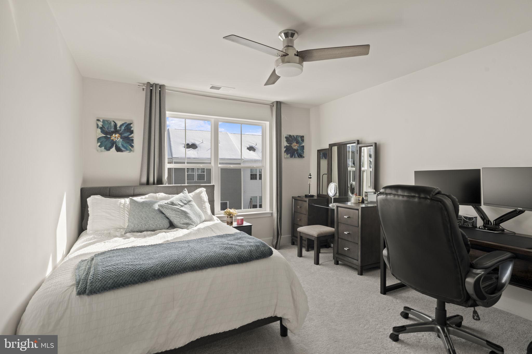 917 Anvil Court Phoenixville, PA 19460 - Photo 27 of 34 a bedroom with a bed a computer on the desk and chair