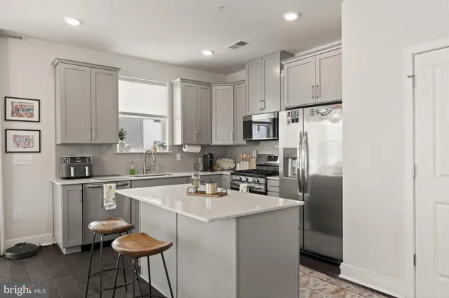 a view of a livingroom with furniture and window