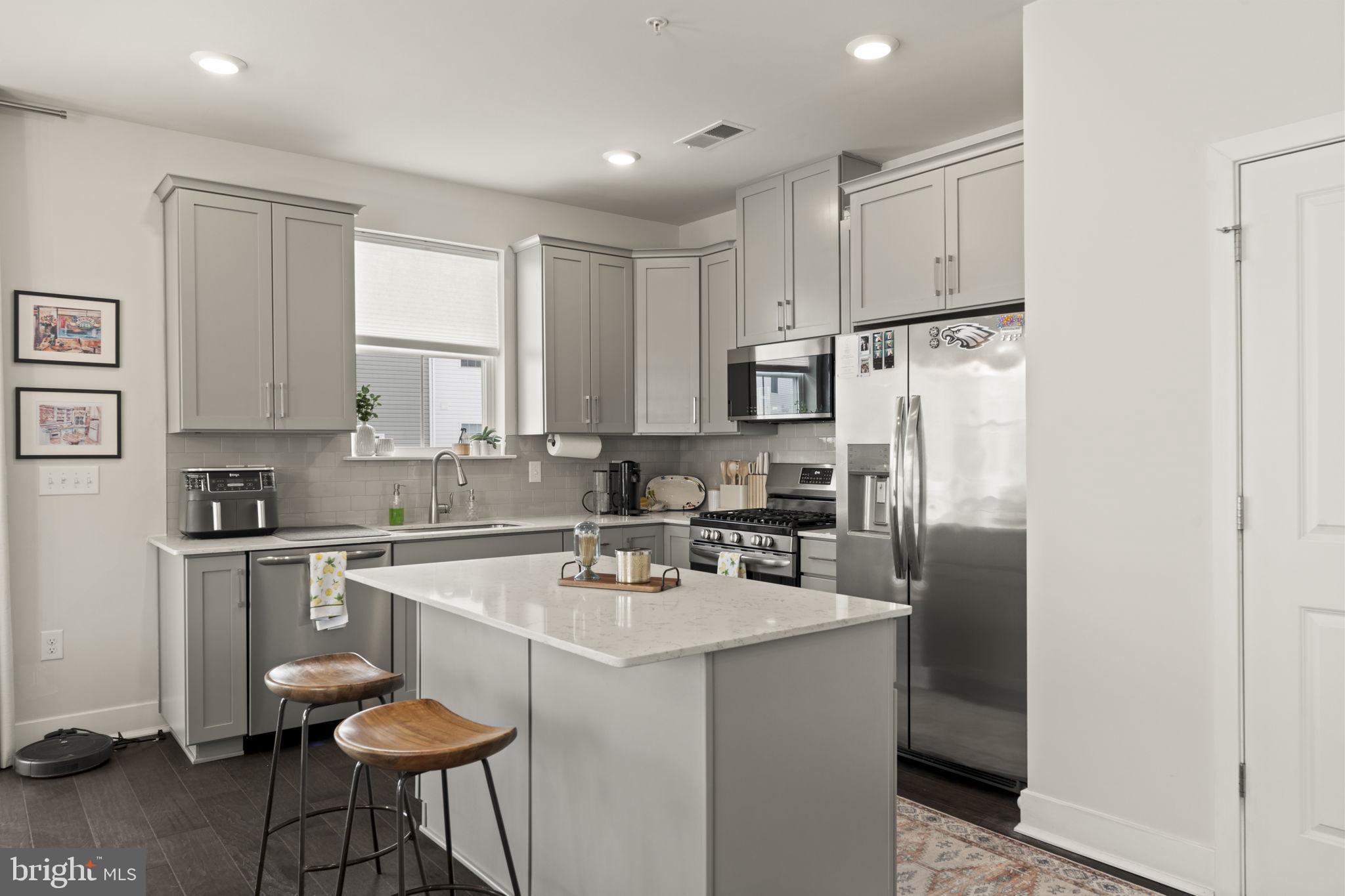917 Anvil Court Phoenixville, PA 19460 - Photo 8 of 34 a kitchen with stainless steel appliances a refrigerator stove microwave and sink