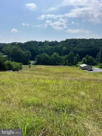 a view of a golf course with a lake view
