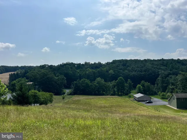 a view of a swimming pool and a yard