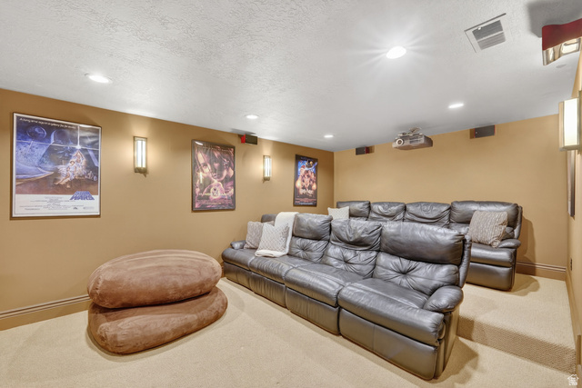 714 Draper Heights Way Draper, UT 84020 - Photo 47 of 88 Carpeted cinema room with a textured ceiling and recessed lighting