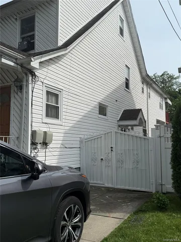 a view of a car park side of a house