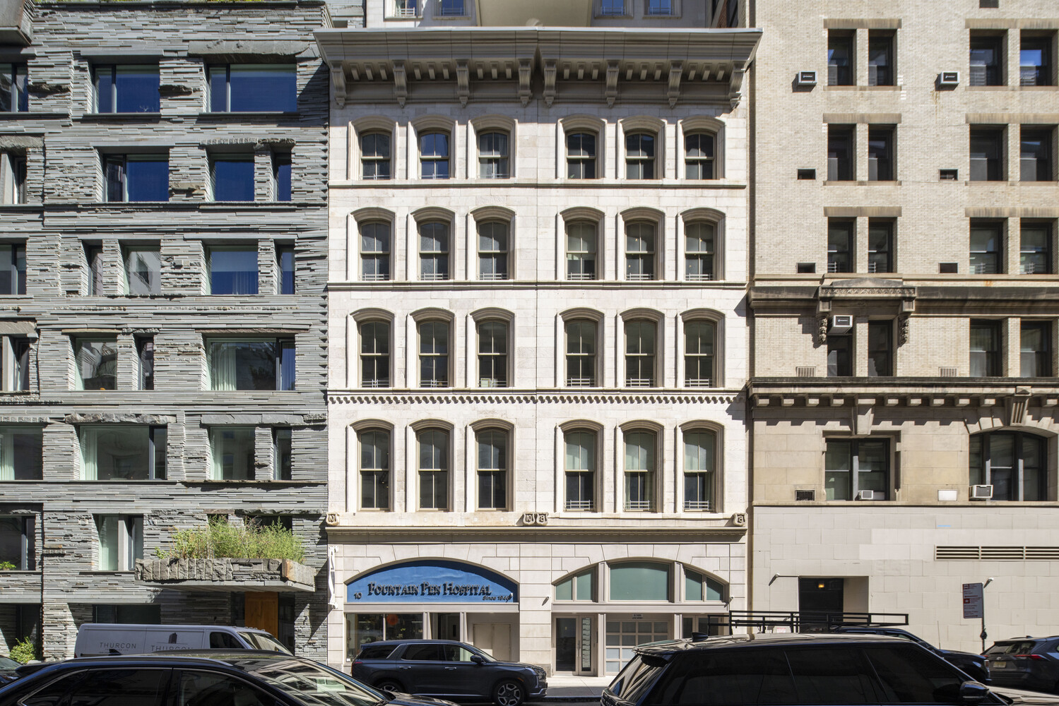8 Warren Street, Unit 2W Manhattan, NY 10007 - Photo 10 of 11 a front view of a building with glass windows
