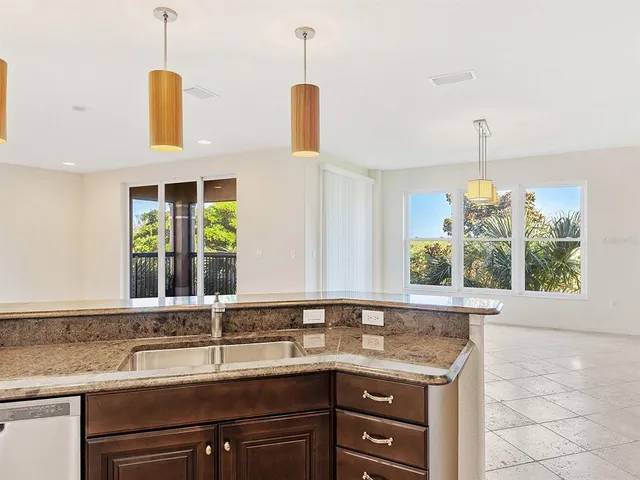a kitchen with a sink and a window