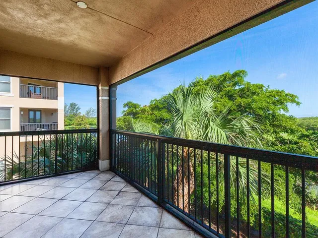 a view of balcony with wooden floor