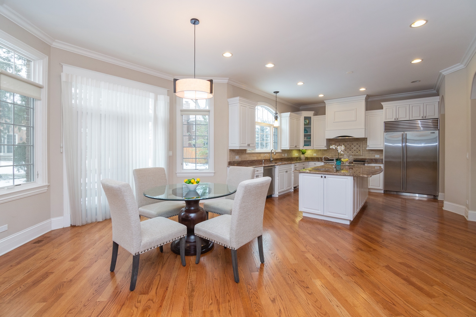 2283 Scott Road Northbrook, IL 60062 - Photo 7 of 33 a living room with stainless steel appliances kitchen island granite countertop wooden floor and a view of kitchen