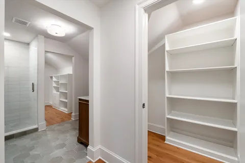 a bathroom with a sink mirror and toilet