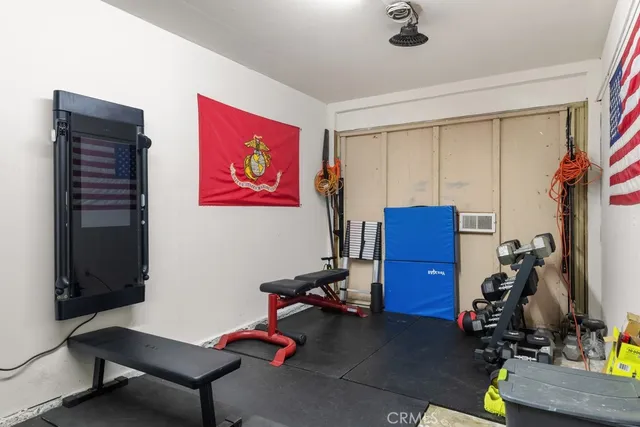 a room with furniture and gym equipment