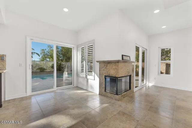 a view of living room with furniture and window