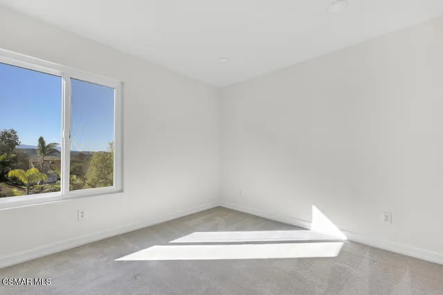 a view of an house with backyard and patio