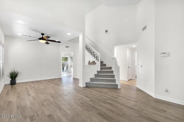 a view of an entryway with wooden floor