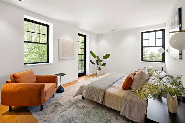 a bedroom with a bed and window