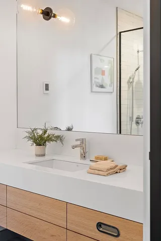 a bathroom with a sink and a mirror