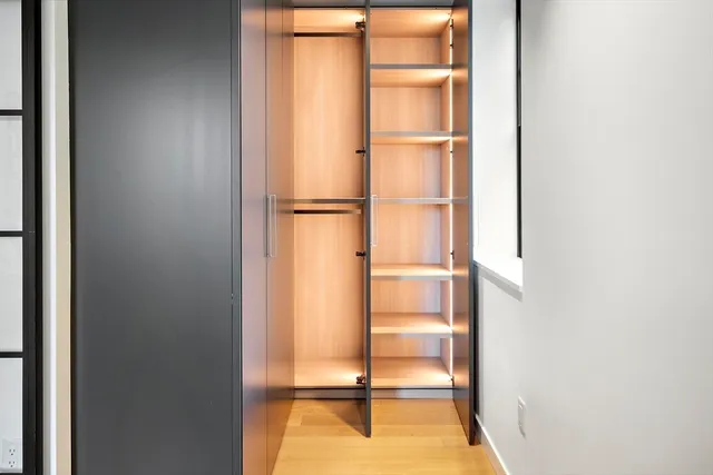 a view of an empty room with a window