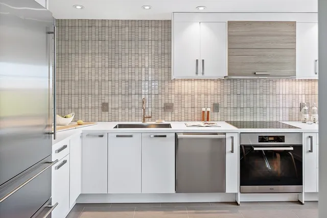 a kitchen with a stove and a sink