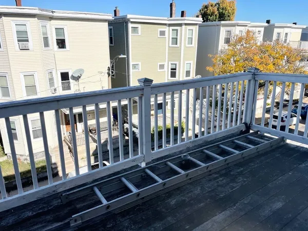a view of a porch with wooden floor