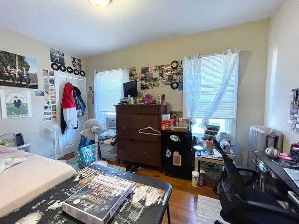 a room with a desk and a window