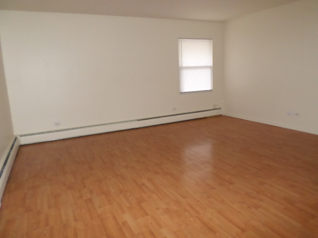 3546 147th Street, Unit 8 Midlothian, IL 60445 - Photo 4 of 8 wooden floor in an empty room with a window