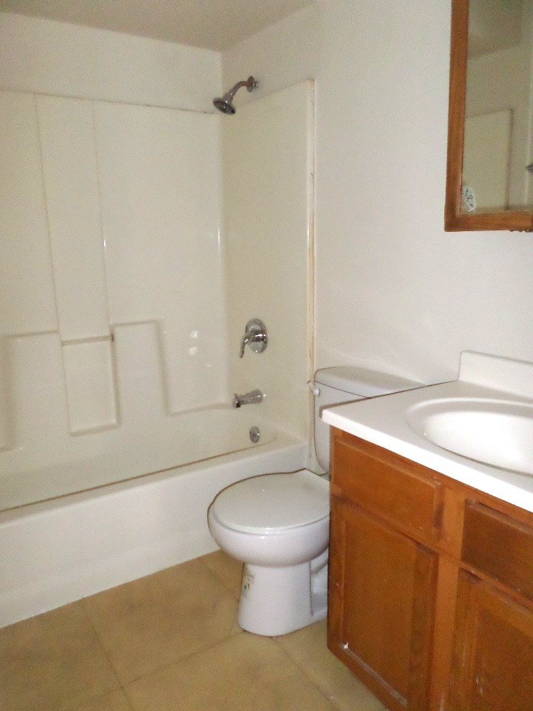3546 147th Street, Unit 8 Midlothian, IL 60445 - Photo 8 of 8 a bathroom with a toilet a sink and bathtub
