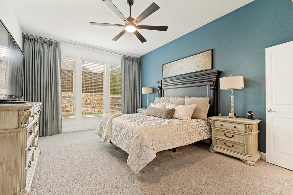 229 Savannah Lane Oak Point, TX 75068 - Photo 14 of 26 a bedroom with a bed dresser and a window